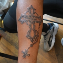 Intricate cross tattoo