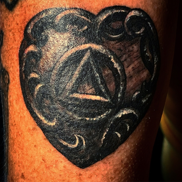 Black-metal-heart-bg-tattoo-cover-up