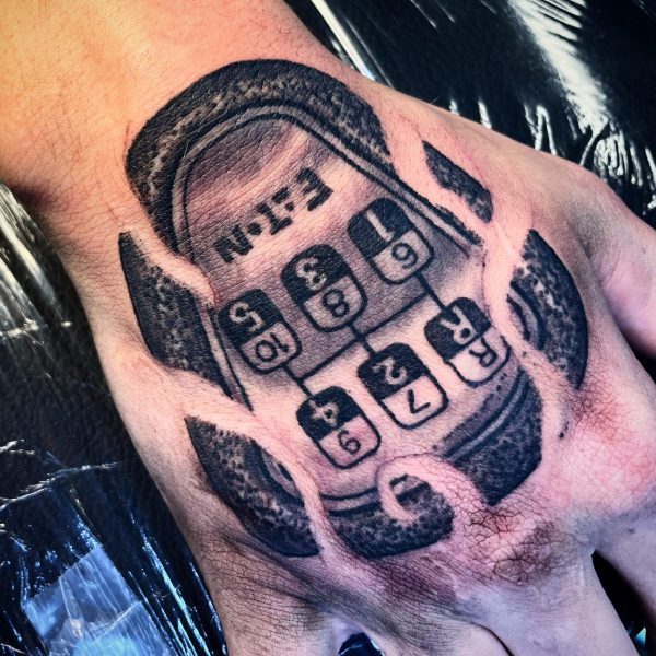 mechanic-shifting-gears-car-tattoo-hand-scaled