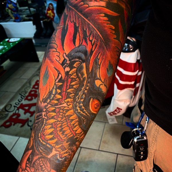 monster-pheonix-feather-tattoo