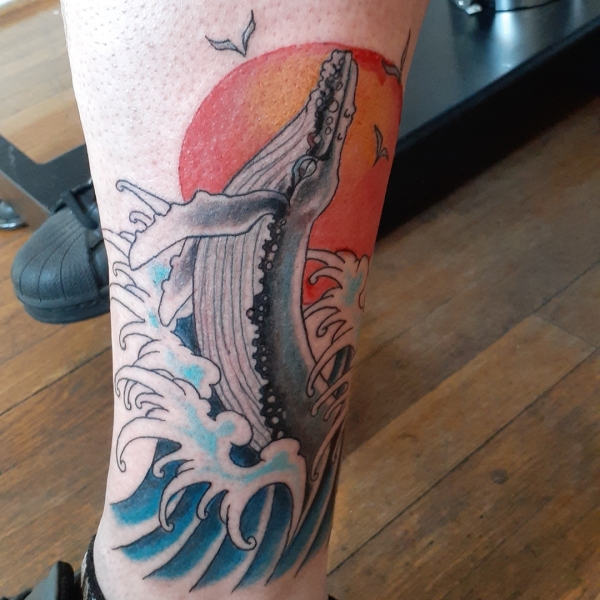 sperm whale tattoo on the calf and shin