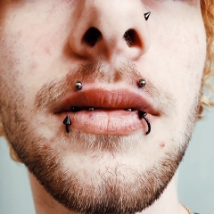 Mouth Piercings with angel bites and snake bites piercings