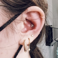 Conch piercing and Triple stacked lobes