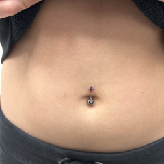 Titanium belly piercing with a black crystal
